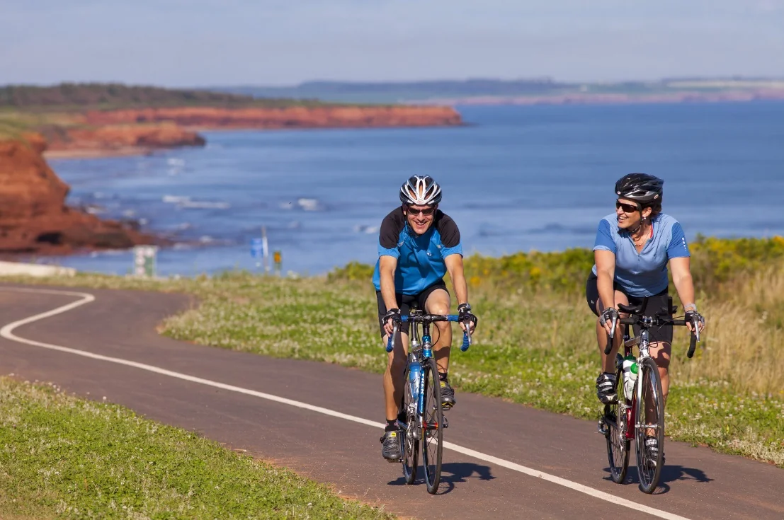 Two cyclists on a coastal road
