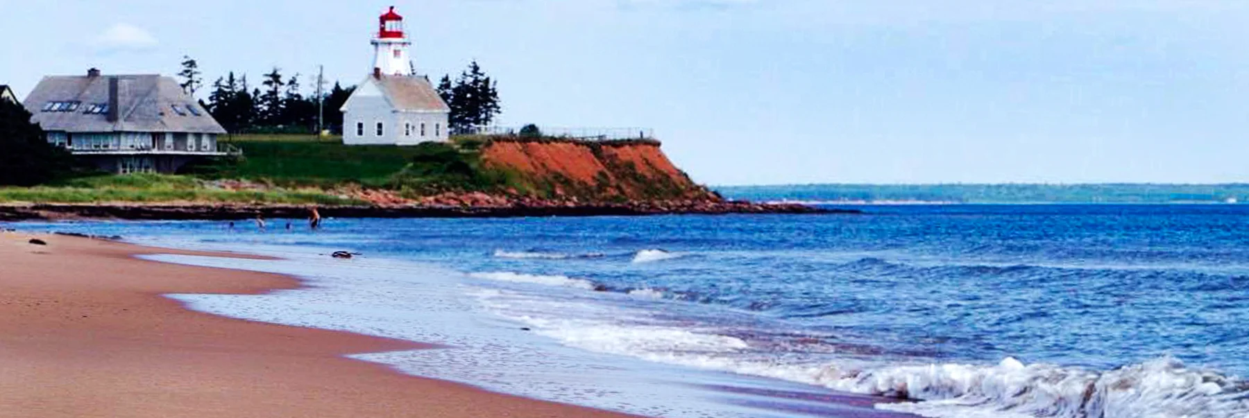 Lighthouse on a red coastal cliff